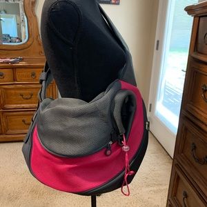 Dog carrier.  Fits a pretty good size dog.